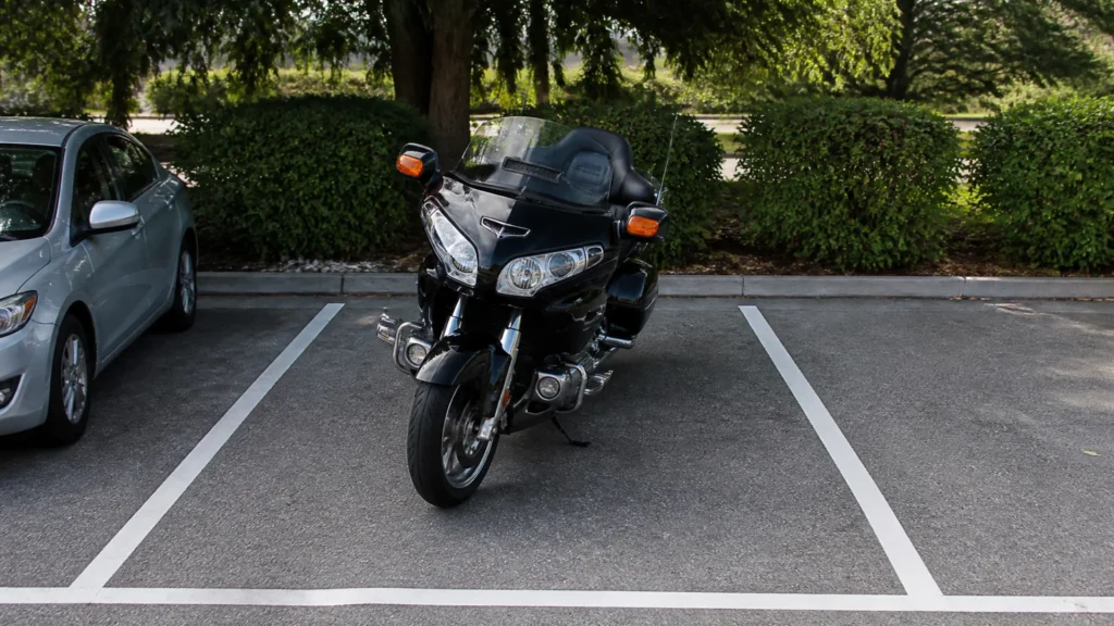 Can you park a large motorcycle in a car parking space?